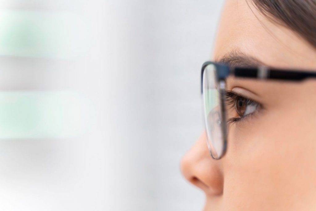 girl store trying glasses close up 1